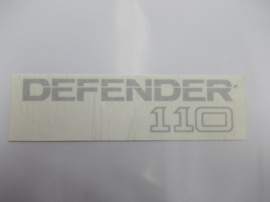 BTR1049 | decal badge tape ""Defender 110"" silver on clear (27cm)